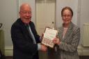 Dennis Coates, chairman of the NALC award panel, presents the award to Jean Peacock, chairwoman of Hurworth Parish Council