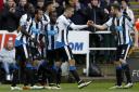 Newcastle United's Andros Townsend (left) celebrates scoring his side's third goal with teammates during the Barclays Premier League match at St James' Park, Newcastle