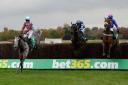 Irish Cavalier, ridden by Jonathan Moore (left), clears the last fence to win the bet365 Charlie Hall Chase at Wetherby last Saturday – Picture: ANNA GOWTHORPE/PA WIRE