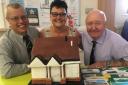NICE SLICE: Sue and the cake with Durham Aged Mineworkers’ Homes boss Paul Mullis, left, and president Gordon Parkin