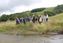 Rishi Sunak meets farmers and residents who have taken part in the Bishopdale natural flood management project by one of the scrapes (temporary ponds) created during the work