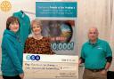 Emma Biggs (centre) presents the cheque to Susan Watson and Dr Anthony Walters, co-chairs of the Friends of the Friarage
