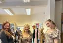 Tammy Ward, one of the organisers, centre, with people trying on the clothes