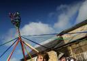 CELEBRATIONS: Reeth Primary School children, dressed in Victorian clothing, dance around the maypole to mark the 150th anniversary