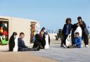 SEAFRONT FAVOURITES: From left, Connor Varley, Imogen Dixon, Max Harrison, Finn Winspur and Uziah Masvaure, all from Errington Primary School, welcome back the refurbished penguins on Redcar seafront.