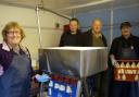 TEAM: Left to right, Jenny, son Ian, Allen, and James Atkinson in the bottling section of the dairy