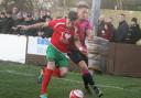PRESSURE: Darlington’s Terry Galbraith, right, tussles for the ball during the win at Harrogate RA