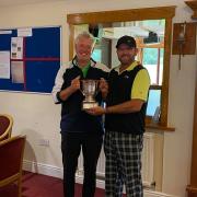 Dion Wood being presented with his trophy by captain Martin Catt