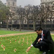 Rishi Sunak places a cross in the Constituency Garden of Remembrance to commemorate the Green Howards