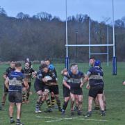 Guisborough (in yellow and black) attempt to force their way through the Bishop Auckland defence
