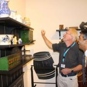 Kiplin Hall volunteer Malcolm Wilkinson explains to Rishi Sunak the stories behind some of the exhibits in the Silent Footsteps exhibition