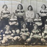 The Darlington Quaker Ladies team photo with the cups they had won during the 1931-32 season. Lillie Galloway is on the right and her husband, James, is on the left