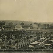 The first auction mart in Northallerton opened in 1873 with the racecourse, complete with grandstand, directly behind it. On the left is the Railway Hotel and Posting House, which was once known as the Horse and Jockey and is now the Station Hotel.