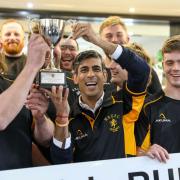 Rishi Sunak with members of Wensleydale RUFC 1st XV and the Yorkshire 2 championship trophy
