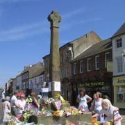 Flowers laid on the Market Cross in Northallerton in memory of Ben Hyde after his death on June 24, 2003