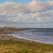 Looking down to the turbines at Redcar, from the coast road by Pat Blewitt