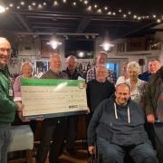 The cheque is presented to Nick Gilboy of the GNAAS