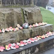 Painted stones from Marwood Infant School on the war memorial