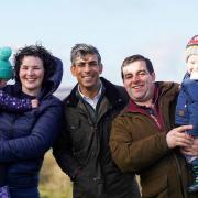 Mr Sunak with Adam Hunter, his wife Leanne, and their two children Annie and Ted