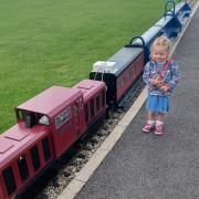 Lily Turnbull with the new miniature train, The James Cook