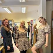 Tammy Ward, one of the organisers, centre, with people trying on the clothes