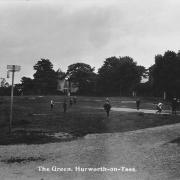 Children play cricket on undulating Hurworth Green about 100 years ago. All Saints Church tower can be seen on the left. The white building in the middle is Dovercourt with the old track known as Knellgate to the right of it