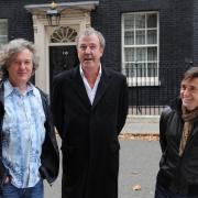 Former Top Gear presenter Jeremy Clarkson (centre) and his co-stars Richard Hammond (right) and James May who have a new motoring show on Amazon. Picture: Stefan Rousseau/PA Wire