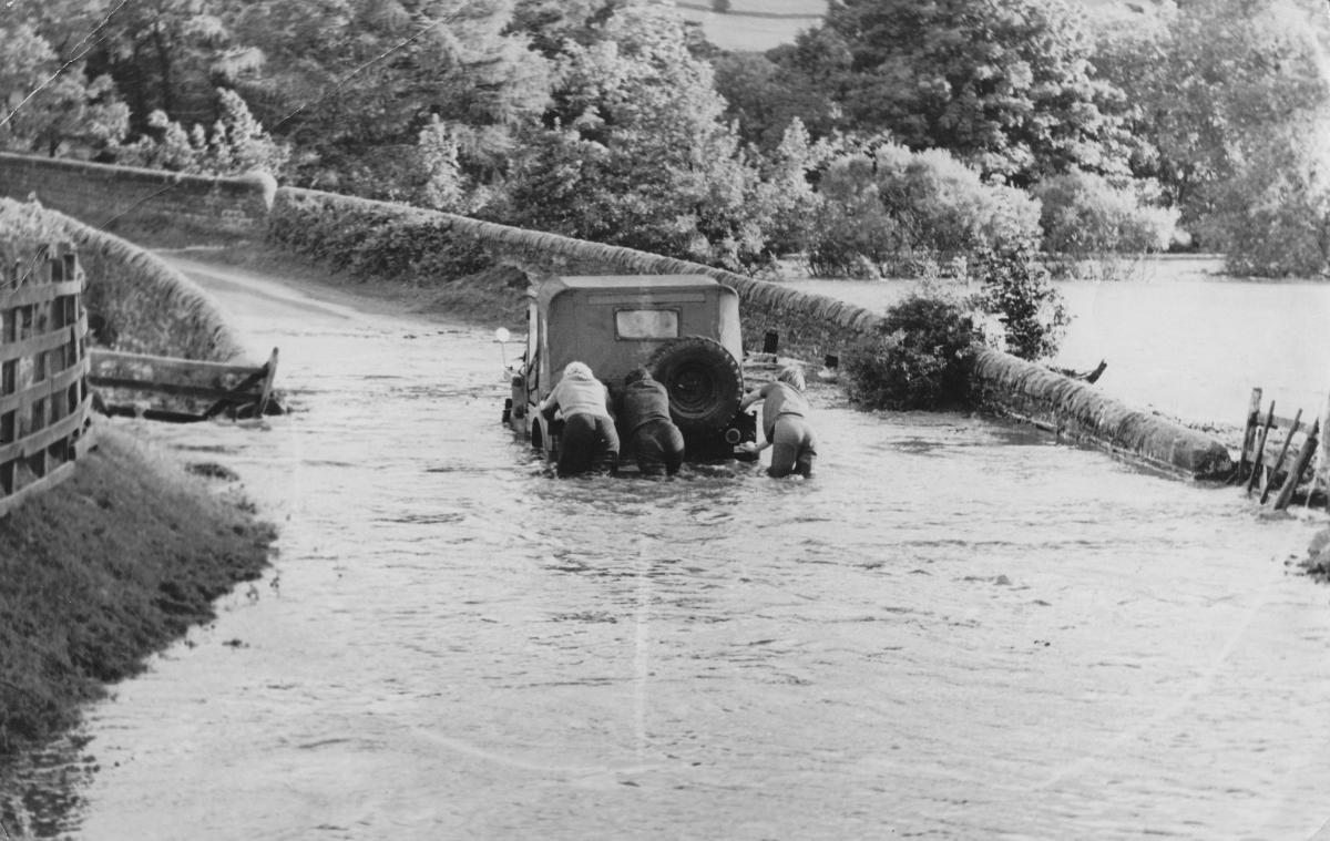 Rescuing a vehicle from flood water, August 1962