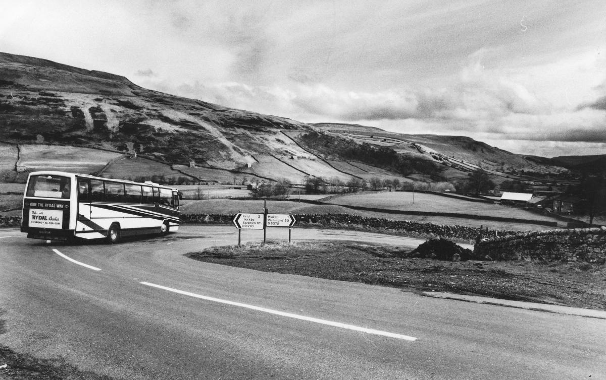 The view down Swaledale as a coach negotiates the Buttertubs road, March 1989