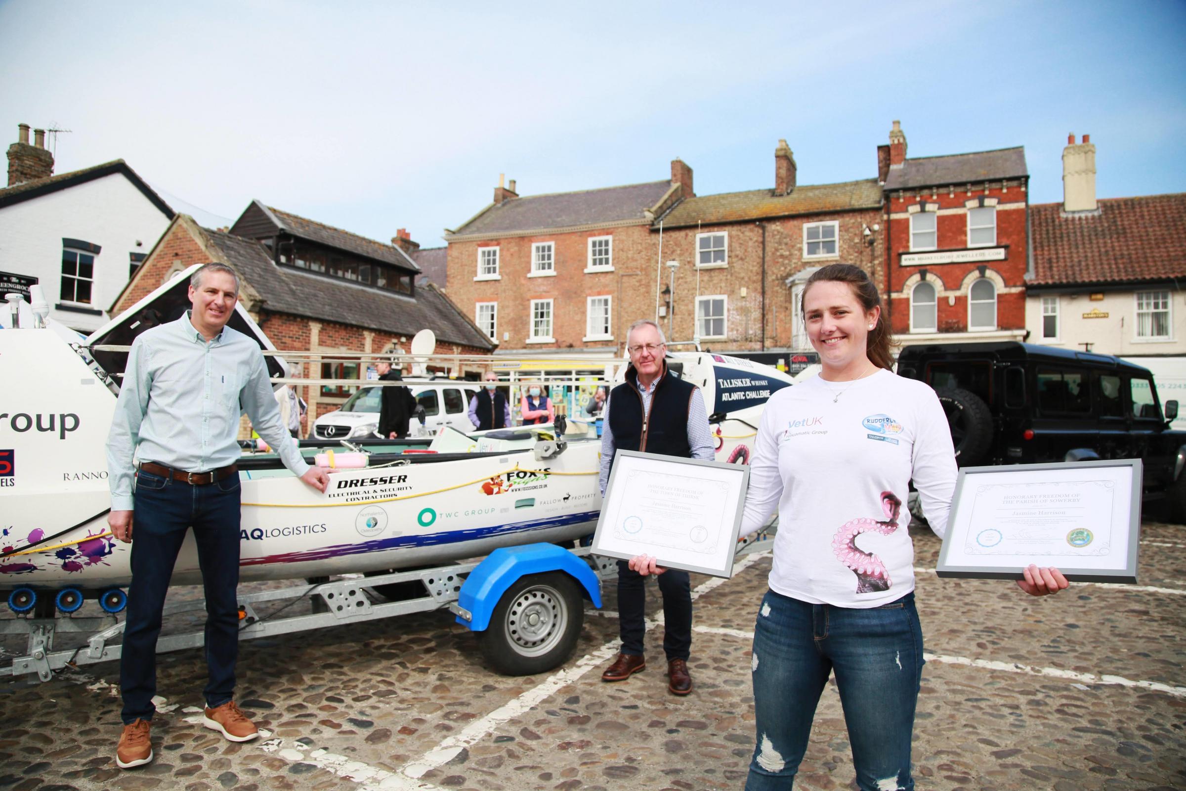 Atlantic Rower Jasmine Harrison with her boat in Thirsk Market Place David Jackson Deputy Mayor of Thirsk and Mark Robson Chairman of Sowerby Parish Council present her with the freedom of Sowerby certificates Picture: SARAH CALDECOTT