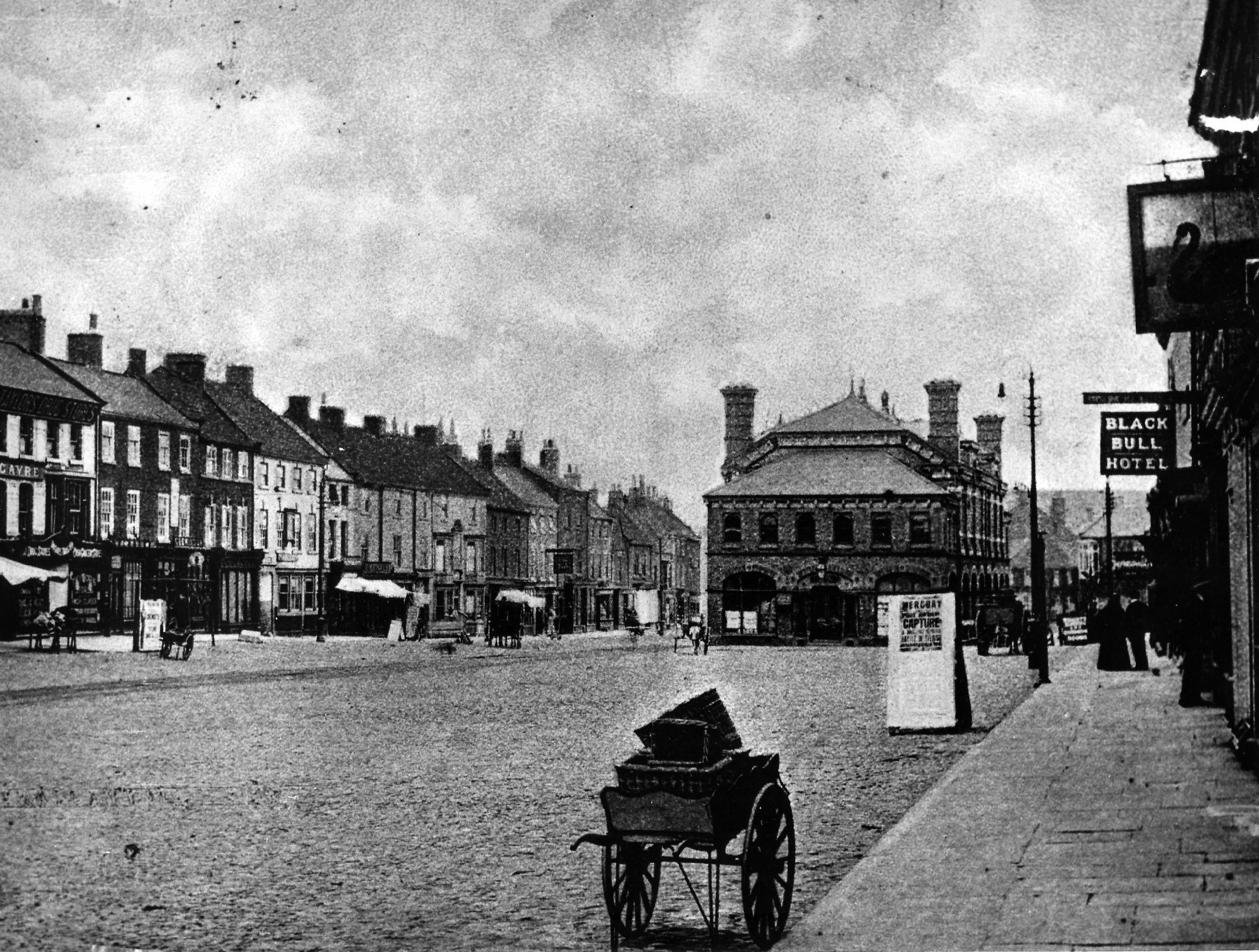 On the right hand side of Northallerton High Street is the Black Bull at No 101 - it received the first London to Edinburgh coach in 1785 - and is that the top of the crooked neck of the Black Swan, at No 104, on the inn sign closest to the camera