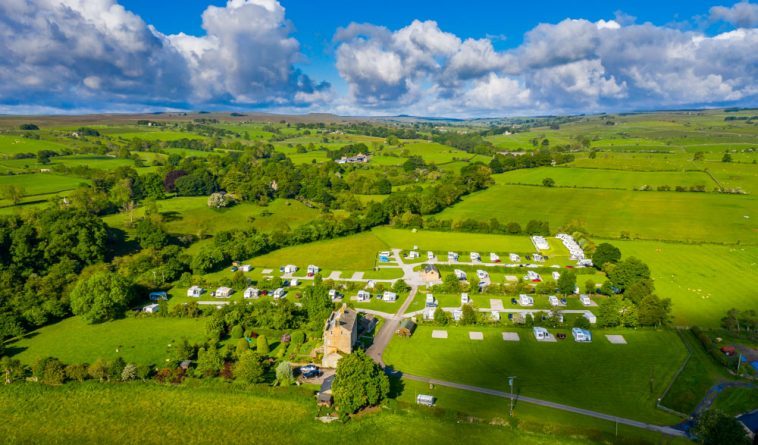 Doe Park at the front, surrounded by its caravan site in the beautiful Teesdale countryside. The treeline on the right is the course of the River Balder and contains our 800-year-old oak