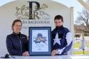 Jockey Brian Hughes receives his award at Perth Racecourse