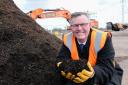Bob Borthwick shows off a sample of compost