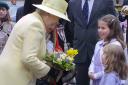 The Queen is presented with flowers by sisters Rebecca and Harriet Ashley during the Queen's Jubilee visit to Darlington yesterday - D08/05/02AL.