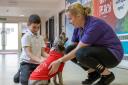 Amadeus, with owner Jo Beaton, and Mohammed, seven, at Skerne Park Academy, in Darlington. Picture: Chris Barron