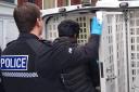 Suspect being loaded into rear of police van in Darlington. Pictures: GRAEME HETHERINGTON