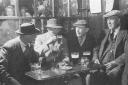 A great picture of the snug in the Bishop Blaize Hotel in Richmond Market Place in 1945 with people in the bar behind looking through the glass partition as the regulars have their picture taken
