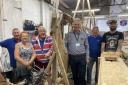 Darlington Building Society chief executive, Andrew Craddock, with Bob Marshall and fellow volunteers at The Viking Boat Company
