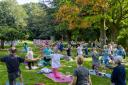 Yoga practitioners gathered in the grounds of Walworth Castle to raise money for Cancer Research UK