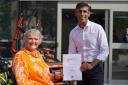 Rishi Sunak presents Debbie North with her Points of Light award at Richmond Swimming Pool wheelchair hub