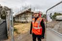 Build manager Bradley Lowes on site at Hopetown Darlington with the former Head of Steam behind him. Picture: Sarah Caldecott