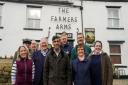 Rishi Sunak with members of the Muker Community Pub group outside the Farmers Arms