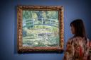 Dr Beatrice Bertram with Monet's 'The Water-Lily Pond' which will be on display at York Art Gallery from Friday