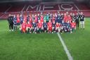 Players from Brompton Juniors and North Yorkshire Soccer Academy at the Riverside Stadium in Middlesbrough for the charity match