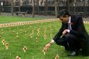 Rishi Sunak places a cross in the Constituency Garden of Remembrance to commemorate the Green Howards