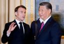French President Emmanuel Macron talks with Chinese President Xi Jinping (Ludovic Marin via AP)