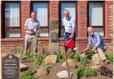 The Rotary Garden with, from left to right, President Chris Johnson, Council Leader Mark Robson, and President Malcolm Warne, with a close-up of the Rotary plaque, inset