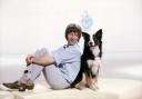 John Noakes sitting back-to-back with Shep, the Blue Peter dog who may have been born in Croft next to the airfield