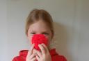 Laura Oosthuizen makes red pom poms to raise money for Comic Relief